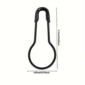Black metal safety pin with measurements on a white background